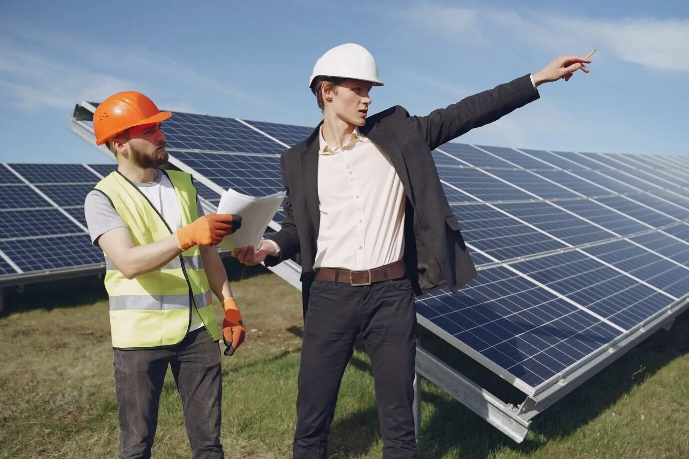 A foreman and a businessman at a solar power station.